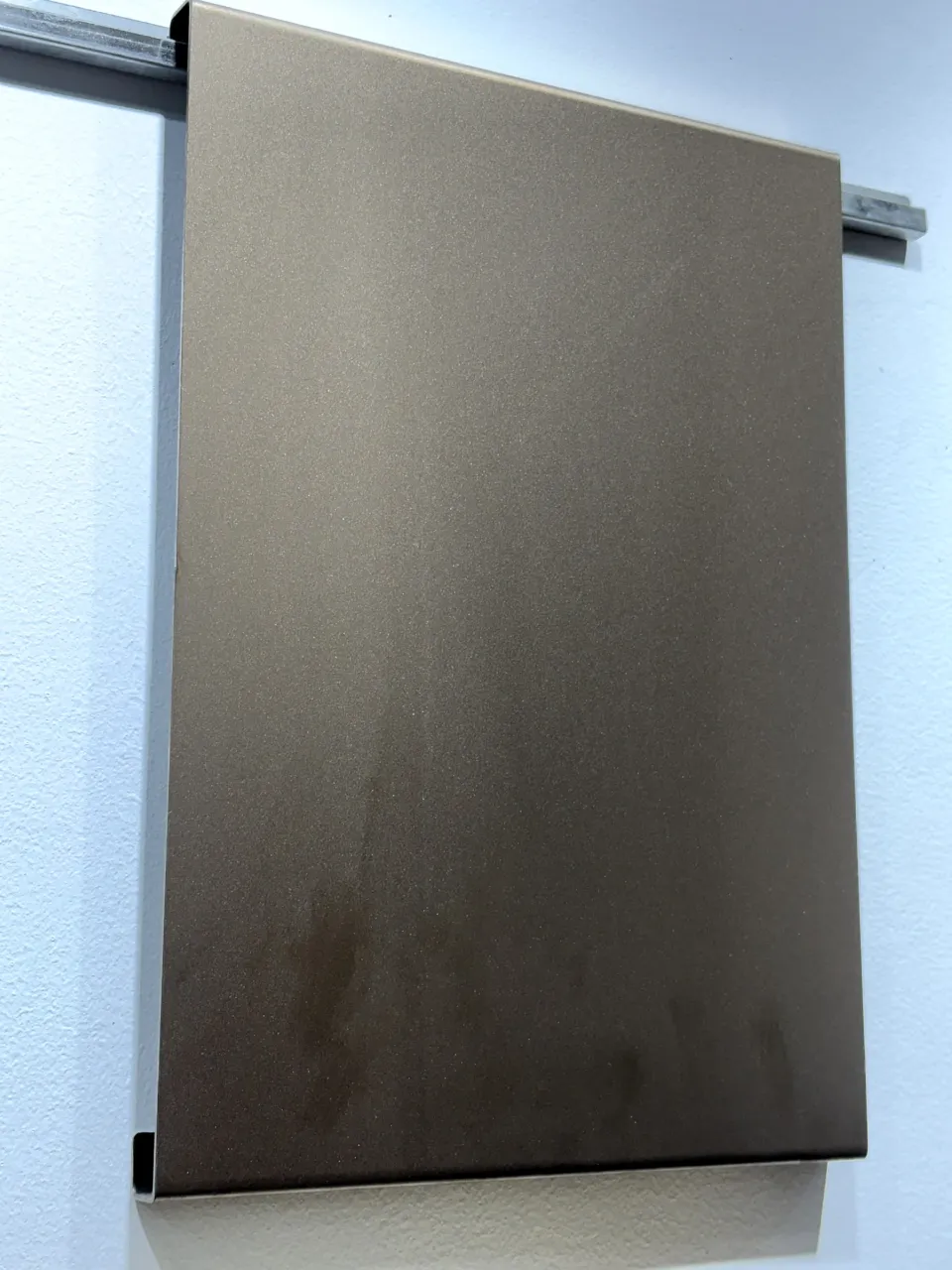 Bead blast stainless steel panel in a grey bronze tone