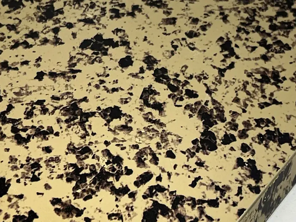 Close-up of a speckled antique gold stainless steel sheet